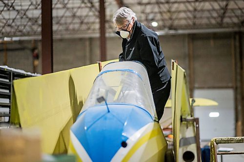 MIKAELA MACKENZIE / WINNIPEG FREE PRESS

Frank Roberts, consulting engineer, measures out a Schweizer Glider (one of the seven aircraft that will be hung from the roof in the new facility) at the warehouse where exhibits are being conserved, restored, and prepared for the Western Canadian Aviation Museum (which is slated to open at the old airport in 2022) in Winnipeg on Wednesday, Feb. 3, 2021. Photo page.

Winnipeg Free Press 2021