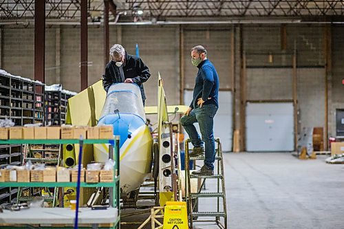 MIKAELA MACKENZIE / WINNIPEG FREE PRESS

Frank Roberts, consulting engineer, measures out a Schweizer Glider (one of the seven aircraft that will be hung from the roof in the new facility) as project manager Joel Nelson discusses the logistics with him at the warehouse where exhibits are being conserved, restored, and prepared for the Western Canadian Aviation Museum (which is slated to open at the old airport in 2022) in Winnipeg on Wednesday, Feb. 3, 2021. Photo page.

Winnipeg Free Press 2021