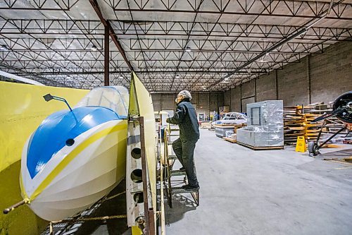 MIKAELA MACKENZIE / WINNIPEG FREE PRESS

Frank Roberts, consulting engineer, measures out a Schweizer Glider (one of the seven aircraft that will be hung from the roof in the new facility) at the warehouse where exhibits are being conserved, restored, and prepared for the Western Canadian Aviation Museum (which is slated to open at the old airport in 2022) in Winnipeg on Wednesday, Feb. 3, 2021. Photo page.

Winnipeg Free Press 2021