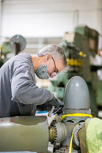 MIKAELA MACKENZIE / WINNIPEG FREE PRESS

Matt Halpin works on restoring propeller at the warehouse where exhibits are being conserved, restored, and prepared for the Western Canadian Aviation Museum (which is slated to open at the old airport in 2022) in Winnipeg on Wednesday, Feb. 3, 2021. Photo page.

Winnipeg Free Press 2021