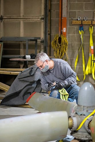 MIKAELA MACKENZIE / WINNIPEG FREE PRESS

Matt Halpin works on restoring propeller at the warehouse where exhibits are being conserved, restored, and prepared for the Western Canadian Aviation Museum (which is slated to open at the old airport in 2022) in Winnipeg on Wednesday, Feb. 3, 2021. Photo page.

Winnipeg Free Press 2021