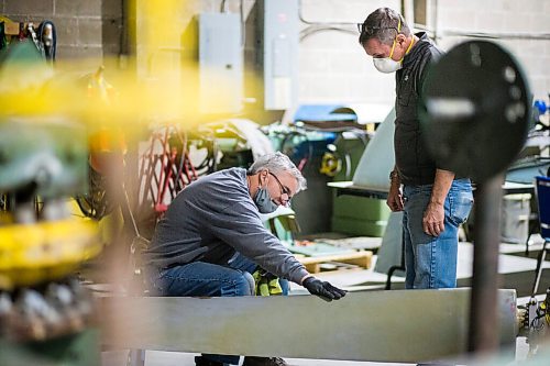 MIKAELA MACKENZIE / WINNIPEG FREE PRESS

Matt Halpin (left) and Marsh Pettitt work on restoring a propeller at the warehouse where exhibits are being conserved, restored, and prepared for the Western Canadian Aviation Museum (which is slated to open at the old airport in 2022) in Winnipeg on Wednesday, Feb. 3, 2021. Photo page.

Winnipeg Free Press 2021