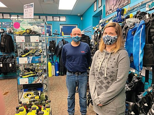 Canstar Community News Wayne Kolomi, who co-owns Diver City Scuba with his wife, Jacqui Dufault, is pictured here with diving instructor Meaghan Noakes in the store at 731 St. Marys Rd.