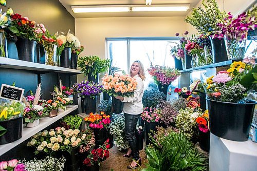 MIKAELA MACKENZIE / WINNIPEG FREE PRESS

Julie Myers, owner of Floral Fixx, poses for a portrait in the flower cooler at the shop in Winnipeg on Monday, Feb. 8, 2021. For Nicole story.

Winnipeg Free Press 2021