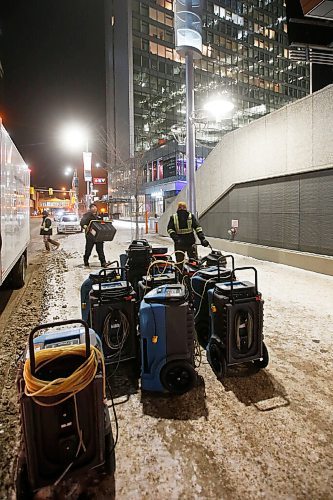 JOHN WOODS / WINNIPEG FREE PRESS
Workers from  Priority Restoration prepare to clean up at True North Square. Flooding affecting RWB students was reported at True North Square buildings in Winnipeg Monday, February 8, 2021. 

Reporter: ?