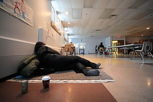 =RUTH BONNEVILLE / WINNIPEG FREE PRESS 

Local - Homeless shelters

A person lays on a mat and others watch a movie while warming up in the multipurpose room at 1JustCity's Just centre as frigid temperatures make it dangerous to spend a lot of time outside Tuesday.  
Subject: 1JustCity's Just centre at 365 McGee st. is open for people to drop in and enjoy a hot drink, food and even watch a movie in their multi-purpose room.

See story by Malak Abas.

Feb 09, 2021
