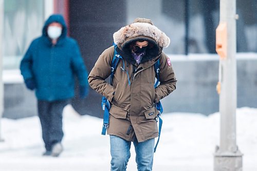 MIKAELA MACKENZIE / WINNIPEG FREE PRESS

Folks brave the cold weather on Portage Avenue in Winnipeg on Tuesday, Feb. 9, 2021. For Sarah story.

Winnipeg Free Press 2021