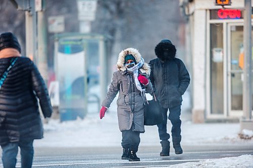 MIKAELA MACKENZIE / WINNIPEG FREE PRESS

Folks brave the cold weather on Portage Avenue at Sherbrook Street in Winnipeg on Tuesday, Feb. 9, 2021. For Sarah story.

Winnipeg Free Press 2021