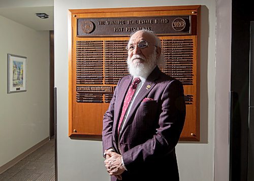 MIKE SUDOMA / WINNIPEG FREE PRESS
Newly elected Winnipeg Regional Real Estate Board President, Kourosh Doustshenas stands in front of the plaque of past board presidents at the Winnipeg Regional Real Estate Board offices Friday afternoon
February 11, 2021