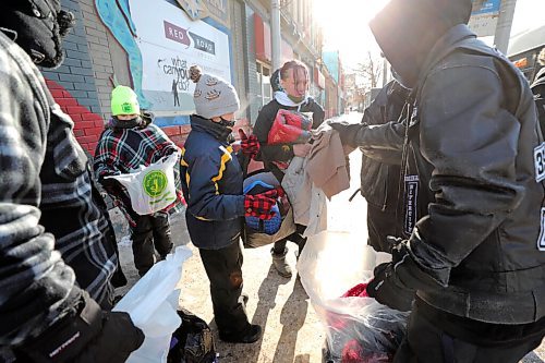 RUTH BONNEVILLE / WINNIPEG FREE PRESS 

Local  Standup - Delivering Warm clothing 

Eleven-year-old Davien Hastings (blue jacket) and Kaycie Jansen (green hat, 10yrs) hand out warm clothing to people in need with their dad Daniel Desorcy (not in this photo) and members of a charitable group called, Crazy Indians Brotherhood (CIB),  on Main Street Friday in need in the extreme cold Friday.  

Founded in 2007, the CIB is a support group for Aboriginal and Metis men looking to disassociate themselves from life in a gang and also to help out people living on the street or homeless with basic needs through donations from local businesses, churches and individuals. 

The group s trying to provide a change from the thug life.

Feb 12, 2021
