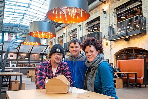 MIKE SUDOMA / WINNIPEG FREE PRESS 
The Hechter family (left to right) (Ben, Sam and Penny)enjoy their first dine in meal from Fergies Fish and Chips at The Forks since the code red lockdown this past November. 
FEBRUARY 12, 2021