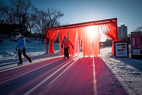 Daniel Crump / Winnipeg Free Press. People skate through an art installation on the Assiniboine River skating trail near the Forks. February 13, 2021.