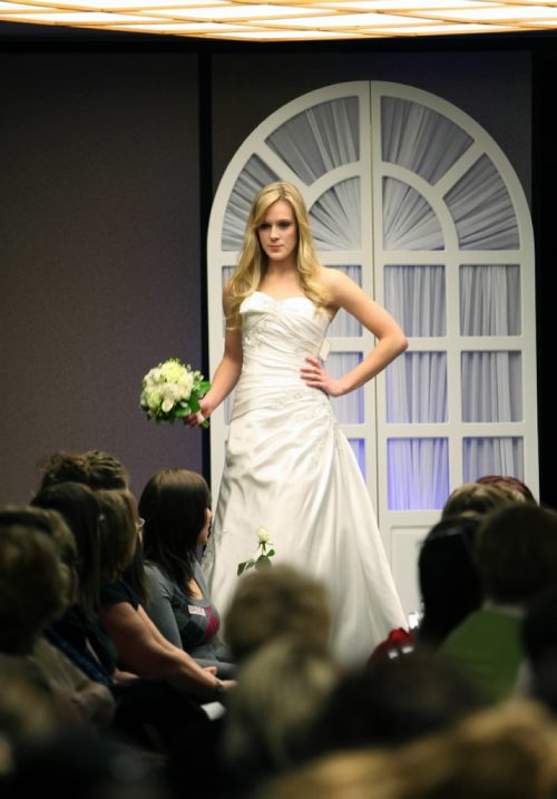 Brandon Sun 31012010 A young woman models a wedding dress during the fashion show at the Westman Wedding Expo at the Victoria Inn on Sunday afternoon. The event was put on by Party Professionals and Rental Company, Expressions Entertainment Services and the Victoria Inn, and featured dozens of vendors offering everything wedding related.  (Tim Smith/Brandon Sun)