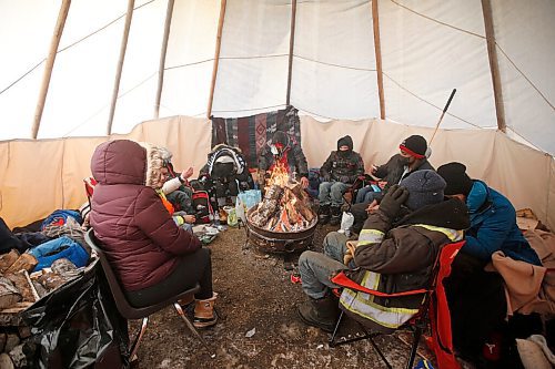 JOHN WOODS / WINNIPEG FREE PRESS
People warm up in a teepee at the Anishinative camp at Thunderbird House in Winnipeg Sunday, February 14, 2021.

Reporter: Sellar