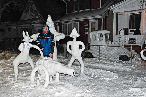 Canstar Community News Leigh Keist shows off some of the snow creations in front of his home on Aberdeen Street.