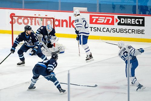 Daniel Crump / Winnipeg Free Press. Moose goalie Mikhail Berdin (40) makes a save on Marlies Nick Robertson (89). Manitoba Moose vs. Toronto Marlies at Bell MTS Centre, Winnipeg. February 15, 2021.