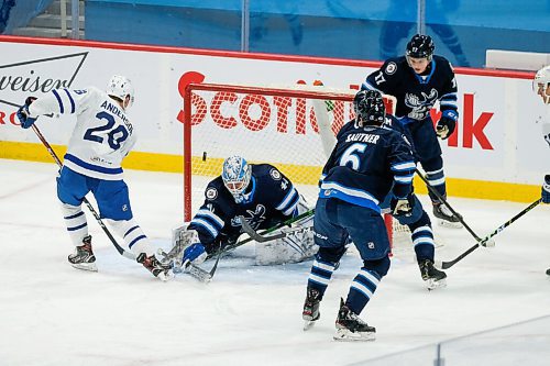 Daniel Crump / Winnipeg Free Press. Manitoba Moose goalie Mikhail Berdin (40) makes a save on Toronto Marlies Joey Anderson (28) at Bell MTS Centre, Winnipeg. February 15, 2021.