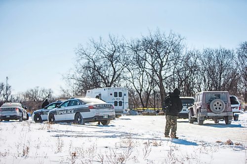 MIKAELA MACKENZIE / WINNIPEG FREE PRESS

Harrison Powder, anti-poverty advocate, watches as police investigate the scene of a fatal fire at an encampment at 50 Higgins Avenue in Winnipeg on Tuesday, Feb. 16, 2021. For Katie story.

Winnipeg Free Press 2021