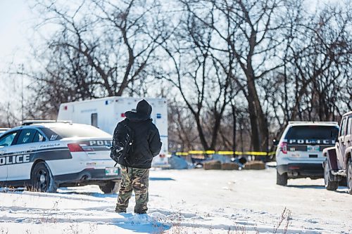 MIKAELA MACKENZIE / WINNIPEG FREE PRESS

Harrison Powder, anti-poverty advocate, watches as police investigate the scene of a fatal fire at an encampment at 50 Higgins Avenue in Winnipeg on Tuesday, Feb. 16, 2021. For Katie story.

Winnipeg Free Press 2021