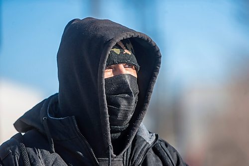 MIKAELA MACKENZIE / WINNIPEG FREE PRESS

Harrison Powder, anti-poverty advocate, watches as police investigate the scene of a fatal fire at an encampment at 50 Higgins Avenue in Winnipeg on Tuesday, Feb. 16, 2021. For Katie story.

Winnipeg Free Press 2021