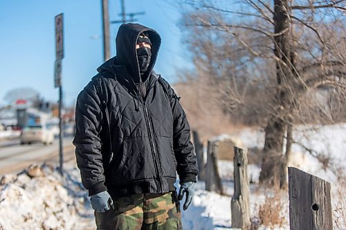 MIKAELA MACKENZIE / WINNIPEG FREE PRESS

Harrison Powder, anti-poverty advocate, watches as police investigate the scene of a fatal fire at an encampment at 50 Higgins Avenue in Winnipeg on Tuesday, Feb. 16, 2021. For Katie story.

Winnipeg Free Press 2021