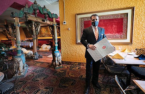 RUTH BONNEVILLE / WINNIPEG FREE PRESS 

Photo of Sachit Mehra, owner, East India Company, near entrance to their restaurant on York Ave.  

Story: Restaurants are opening to the public again

Malak Abas   

Reporter | Winnipeg Free Press

February 16, 2021