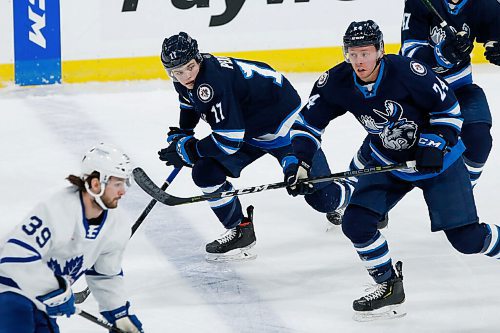 JOHN WOODS / WINNIPEG FREE PRESS
Manitoba Moose Cole Perfetti (17) and Nicholas Jones (24) skate against the Toronto Marlies during first period AHL action in Winnipeg on Sunday, February 16, 2021.

Reporter: McIntyre