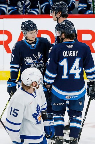 JOHN WOODS / WINNIPEG FREE PRESS
Manitoba Moose Cole Perfetti (17) talks to Jimmy Oligny (14) during second period AHL action against the Toronto Marlies in Winnipeg on Sunday, February 16, 2021.

Reporter: McIntyre