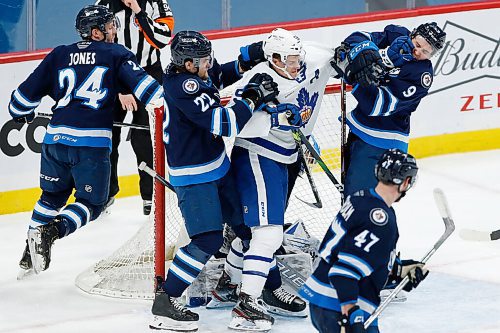 JOHN WOODS / WINNIPEG FREE PRESS
Manitoba Moose Joona Luoto (22) and Leon Gawanke (9) mix it up with Toronto Marlies Tyler Gaudet (58) in front of goaltender Mikhail Berdin (40) during second period AHL action in Winnipeg on Sunday, February 16, 2021.

Reporter: McIntyre