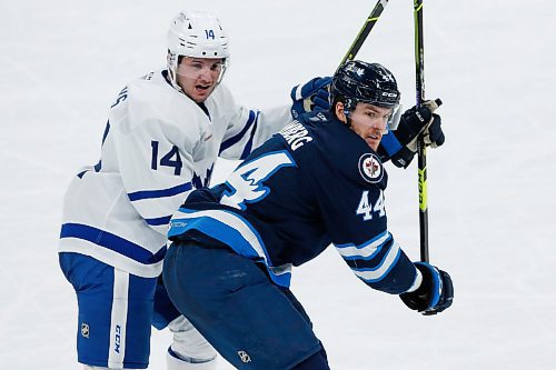 JOHN WOODS / WINNIPEG FREE PRESS
Manitoba Moose Dylan Samberg (44) drives for the net against Toronto Marlies Adam Brooks (14) during second period AHL action in Winnipeg on Sunday, February 16, 2021.

Reporter: McIntyre