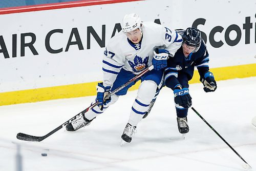 JOHN WOODS / WINNIPEG FREE PRESS
Toronto Marlies Scott Pooley (37) gets around Manitoba Moose Declan Chisholm (47) during second period AHL action in Winnipeg on Sunday, February 16, 2021.

Reporter: McIntyre