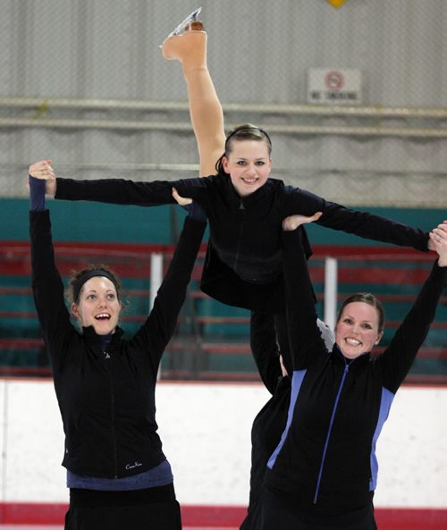 Brandon Sun Shilo Baribeau is lifted by teammates (from left) Debra Mullin, Alisha George (in toque) and Jessica Brown, Monday evening at the Kinsmen Arena. The women were taking part in a practice by the Wheat City ConnXion synchronized skating team. (Colin Corneau/Brandon Sun)