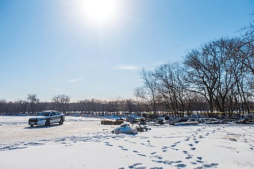 MIKAELA MACKENZIE / WINNIPEG FREE PRESS

One police car remains on the scene of a fatal fire at an encampment at 50 Higgins Avenue in Winnipeg on Wednesday, Feb. 17, 2021. For -- story.

Winnipeg Free Press 2021