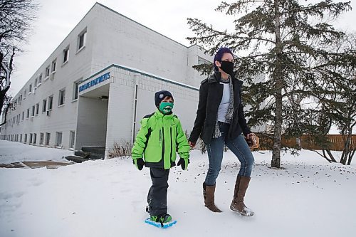 JOHN WOODS / WINNIPEG FREE PRESS
Charity McLellan and her son, Jaxon, are photographed at their apartment building on David Street in Winnipeg Thursday, February 18, 2021. The new owners of the Fairlane Apartments has informed McLellan that her monthly rent will be going from $806 to $1400. McLellan, who is a single mum, student and cares for her elderly mother says the increase will bankrupt her.

Reporter: waldman
