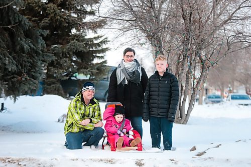 MIKAELA MACKENZIE / WINNIPEG FREE PRESS

John (left), Kyrie, Tammy, and Everett Brinkman pose for a photo in their front yard in Winnipeg on Thursday, Feb. 18, 2021. Four-year-old Kyrie volunteers her time as the ambassador for the Children's Rehabilitation Foundation (and is sitting in a support seat provided by the foundation).  For Aaron Epp story.

Winnipeg Free Press 2021