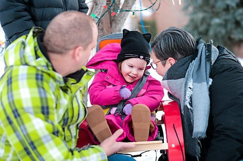 MIKAELA MACKENZIE / WINNIPEG FREE PRESS

Kyrie Brinkman and her parents, John and Tammy, pose for a photo in their front yard in Winnipeg on Thursday, Feb. 18, 2021. Four-year-old Kyrie volunteers her time as the ambassador for the Children's Rehabilitation Foundation (and is sitting in a support seat provided by the foundation).  For Aaron Epp story.

Winnipeg Free Press 2021