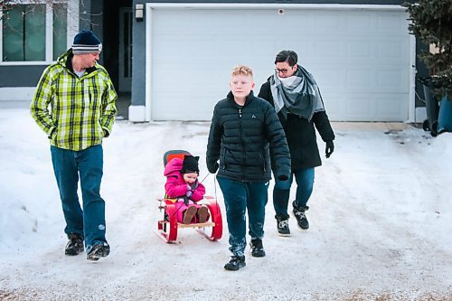 MIKAELA MACKENZIE / WINNIPEG FREE PRESS

John (left), Kyrie, Everett, and Tammy Brinkman pose for a photo in their front yard in Winnipeg on Thursday, Feb. 18, 2021. Four-year-old Kyrie volunteers her time as the ambassador for the Children's Rehabilitation Foundation (and is sitting in a support seat provided by the foundation).  For Aaron Epp story.

Winnipeg Free Press 2021