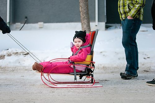 MIKAELA MACKENZIE / WINNIPEG FREE PRESS

Kyrie Brinkman gets pulled by her older brother, Everett, in her sled in Winnipeg on Thursday, Feb. 18, 2021. Four-year-old Kyrie volunteers her time as the ambassador for the Children's Rehabilitation Foundation (and is sitting in a support seat provided by the foundation).  For Aaron Epp story.

Winnipeg Free Press 2021