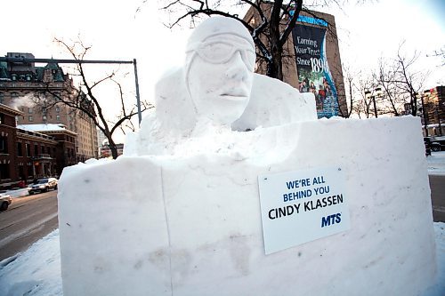 BORIS.MINKEVICH@FREEPRESS.MB.CA BORIS MINKEVICH / WINNIPEG FREE PRESS  100202 Cindy Klassen all over the snow sculpture at Broadway and Main.