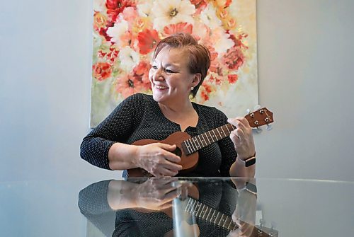 RUTH BONNEVILLE / WINNIPEG FREE PRESS 

ENT - ukulele

 Bev Watson, has just taken up the ukulele in January and has fallen in love with her new, creative outlet.

Bev can't hold back her beaming smile and exuberant joy as she's photographed in her home with her ukulele next to her favourite floral painting.

Description: 
Feature on the rise of people taking up ukuleles during the pandemic, and it's certainly the case in Winnipeg.

Story, by Alan Small, skedded for Tuesday, so we'll need photos for Monday.

Feb 19, 2021
