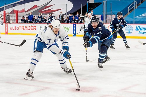 MIKE SUDOMA / WINNIPEG FREE PRESS 
Moose defence, Trent Bourque, moves to block Marlies defence, Timothy Liljegren as the Manitoba Moose take on the Toronto Marlies at Bell MTS Place Friday night
FEBRUARY 19, 2021