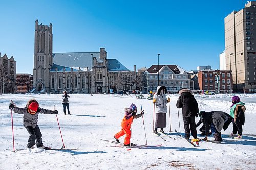 Daniel Crump / Winnipeg Free Press. Families try out cross country skis in Central Park in downtown Winnipeg. The skis were made available by the ski library, which was set up as part of the Heart in the Park event. February 20, 2021.