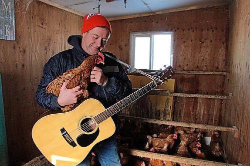 Canstar Community News Russell Loewen records a song in his hen house daily to send to his grandkids. Recently, he's been uploading them to YouTube. He's pictured in his hen house on Feb. 17. (GABRIELLE PICHÉ/CANSTAR COMMUNITY NEWS/HEADLINER)