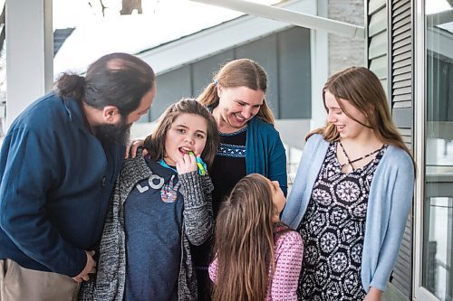 MIKAELA MACKENZIE / WINNIPEG FREE PRESS

Pablo (left), Alejandra (nine), Carrie, Isabel (six), and Emma (13) Felices-Costello pose for a portrait outside of their home in Winnipeg on Monday, Feb. 22, 2021. For Maggie Macintosh story.

Winnipeg Free Press 2021