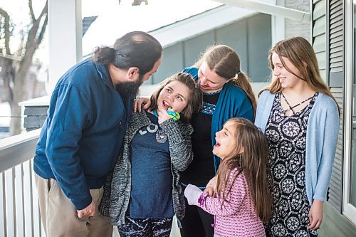 MIKAELA MACKENZIE / WINNIPEG FREE PRESS

Pablo (left), Alejandra (nine), Carrie, Isabel (six), and Emma (13) Felices-Costello pose for a portrait outside of their home in Winnipeg on Monday, Feb. 22, 2021. For Maggie Macintosh story.

Winnipeg Free Press 2021