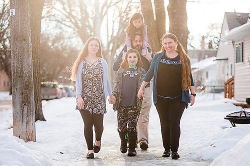 MIKAELA MACKENZIE / WINNIPEG FREE PRESS

Emma (13, left), Alejandra (nine), Isabel (six), Pablo, and  Carrie Felices-Costello pose for a portrait outside of their home in Winnipeg on Monday, Feb. 22, 2021. For Maggie Macintosh story.

Winnipeg Free Press 2021