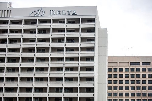 MIKAELA MACKENZIE / WINNIPEG FREE PRESS

Reporter Ben Waldman looks out from his balcony on the 16th floor of the Delta, the city's largest hotel, in Winnipeg on Monday, Feb. 22, 2021. For Ben Waldman story.

Winnipeg Free Press 2021