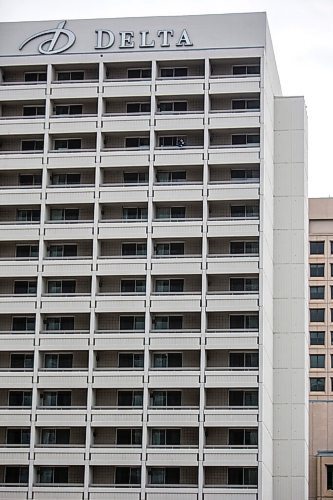 MIKAELA MACKENZIE / WINNIPEG FREE PRESS

Reporter Ben Waldman looks out from his balcony on the 16th floor of the Delta, the city's largest hotel, in Winnipeg on Monday, Feb. 22, 2021. For Ben Waldman story.

Winnipeg Free Press 2021