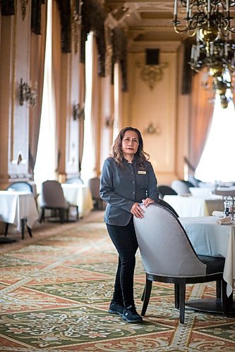 MIKAELA MACKENZIE / WINNIPEG FREE PRESS

Hotel Fort Garry breakfast attendant Elizabeth Pagarigan poses for a portrait in the dining area in Winnipeg on Tuesday, Feb. 23, 2021. For Ben Waldman story.

Winnipeg Free Press 2021