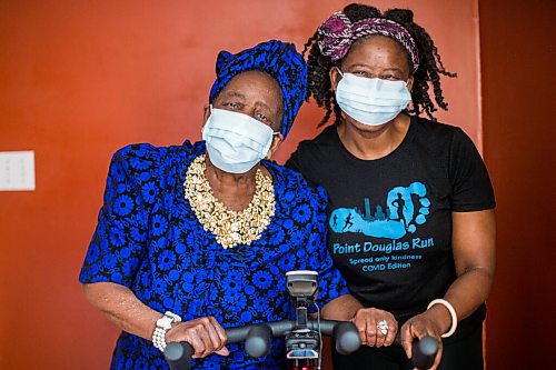 MIKAELA MACKENZIE / WINNIPEG FREE PRESS

Mwaka Kaonga and her mom, Phillis Nachilongo, pose for a photo at the stationary bike in their home in Winnipeg on Wednesday, Feb. 24, 2021. For Sabrina Carnevale story.

Winnipeg Free Press 2021